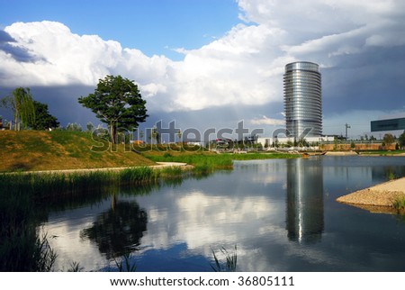 View of Water Tower and a lake with a nice reflection of the tower and a tree