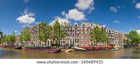 Pretty dutch doll houses reflected in the tranquil canals of Amsterdam.