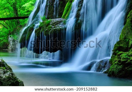 Similar – Image, Stock Photo Waterfall flowing into river in nature