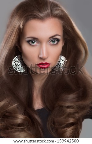 Sexy Beauty Girl with Red Lips. Make up. Luxury Woman with Long hair