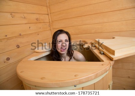 girl in a cedar barrel