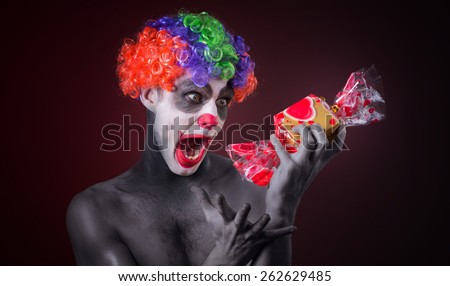 scary clown with spooky makeup and more candy