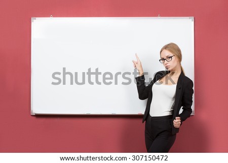 Business girl shows forefinger hand on the blank banner