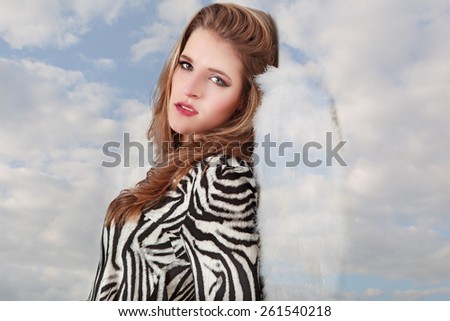 Romantic angel with the sky in her background