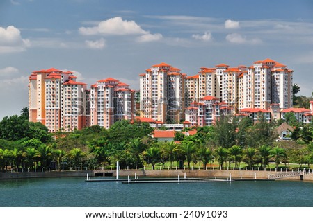 Modern Apartment Block Houses and Garden with Lake