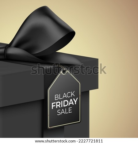 Black Friday Sale vector banner design. Close up view of premium style black gift box, wrapped with satin ribbon, and hanging tag, on a golden background.