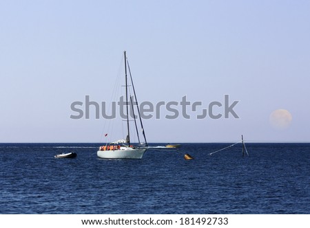 Sport boat on anchor by the sea shore in morning time