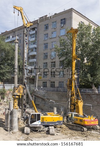 ROSTOV-ON-DON, RUSSIA-AUGUST 24 - Pile drivers clog the pile on the construction of the house August 24, 2013 in Rostov-on-Don