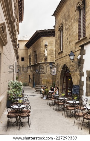 BARCELONA,SPAIN-SEPTEMBER 9- Tourists rest after walk on the Spanish village on September 9,2014 in Barcelona