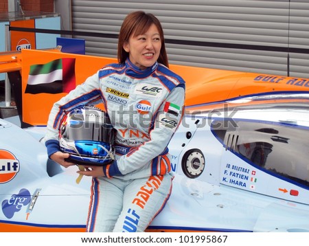 SPA, BELGIUM - MAY 2: Japanese female racing driver Keiko Ihara posing on her Gulf Racing car at circuit Spa-Francorchamps May 2, 2012 in Spa, Belgium.