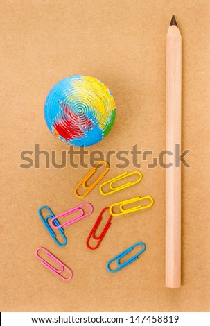 School supplies with Globe, clip and notebook  on white background