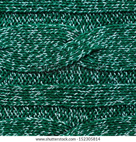 knitted jersey green background with a relief pattern. High resolution Fabric textile background