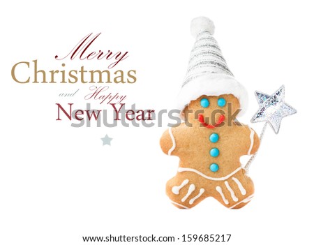 Gingerbread Man Christmas Cookie with Santa hat and magic stick isolated on white background, closeup.  (with easy removable sample text)