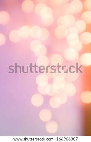 Abstract natural blur defocussed background with sparkles and circle bokeh, pink and gold color.Greeting holiday card, festive frame, magic lights.