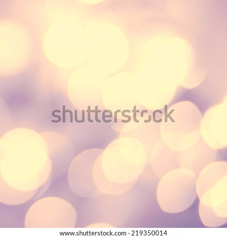 Soft light abstract background. Defocused Bokeh twinkling lights Vintage background.  Festive background with natural bokeh and bright golden lights.