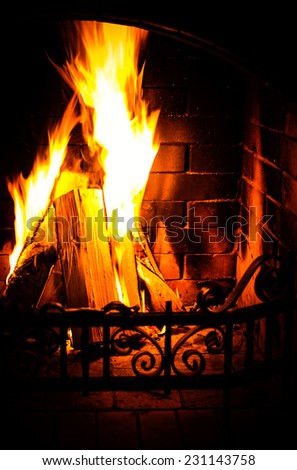 Burning Fireplace. Chimney and woodpile. Chimney place. Christmas fireplace.