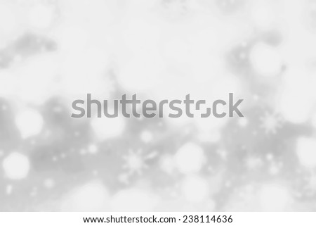 Festive blur background with natural bokeh and bright white  lights. Abstract Christmas twinkled bright background with boke defocused silver  lights