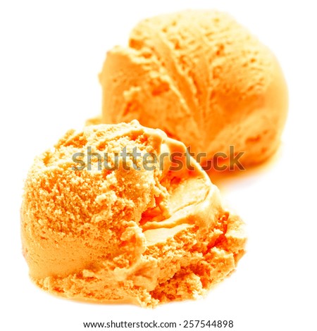 Scoops of Mango ice cream isolated on white background. Ball of Orange Lemon Ice-Cream close up.
