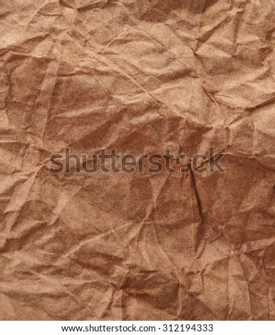 Crumpled recycled paper background texture. Vintage craft paper texture yellow color. Paper for package.