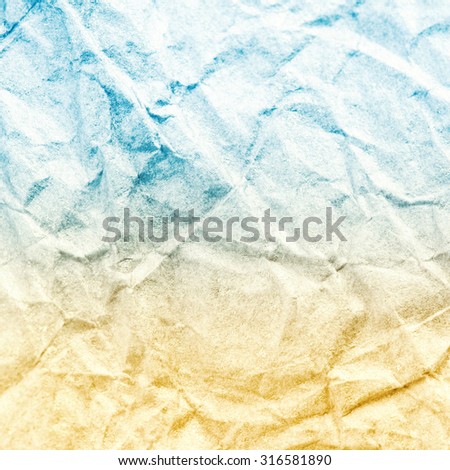 Crumpled recycled paper background texture. Vintage craft paper texture yellow blue  color. Paper for package.