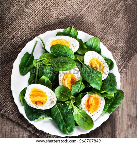 Similar – Image, Stock Photo Spinach salad with eggs avocados tomatoes and mozzarella cheese