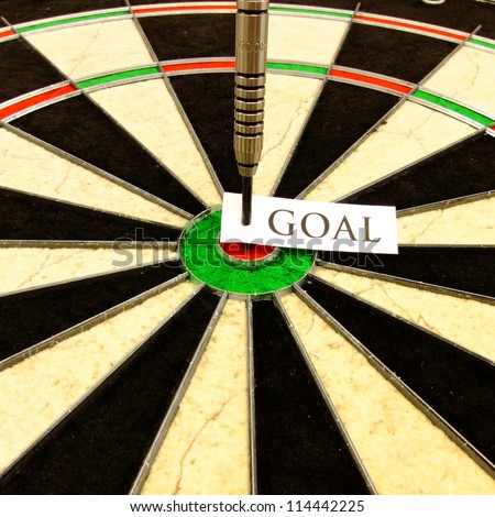 Hitting a conceptual bullseye that represents a business, finance, or personal goal