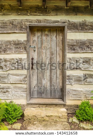 Vintage wood door on a log cabin