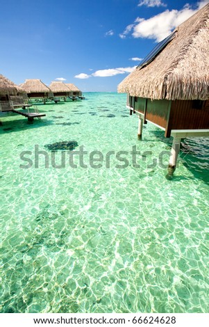 Over water bungalows over amazing tropical lagoon