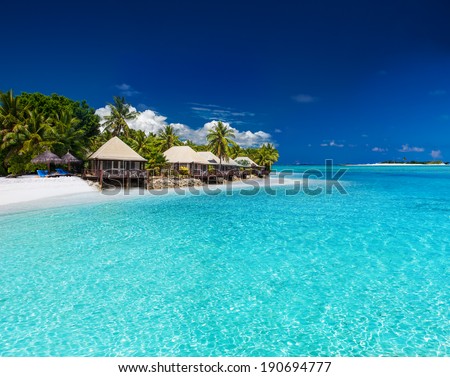 Beach Villas on small tropical island with palm trees Zdjęcia stock © 