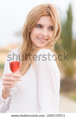 pretty girl outside with a drink