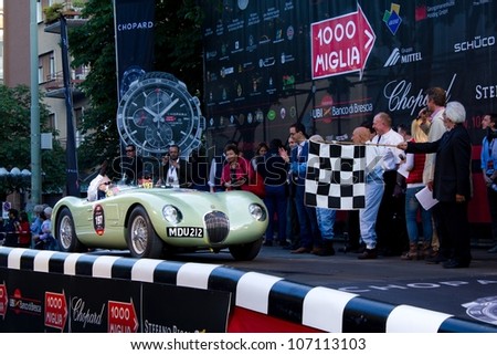BRESCIA ITALY - MAY 17: Green 1952 Jaguar C-Type  driven by R. Frankel starts the 1000 Miglia 2012, on May 17, 2012 in Brescia