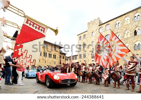 VOLTERRA (PI), ITALY - MAY 17: A red Maserati 300 S Fantuzzi, followed by a blue Porsche 356, takes part to the 1000 Miglia classic car race on May 17, 2014 in Volterra (PI). Both cars built in 1955.