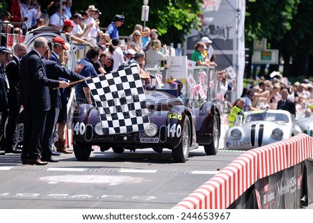 BRESCIA, ITALY - MAY 18: A dark red Alfa Romeo 6C 2300 B MM spider touring finishes the 1000 Miglia classic car race on May 18, 2014 in Brescia. The car was built in 1938