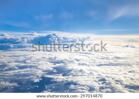 Blur blue sky and Yellowish white cloud.  soft lighting  on the plane