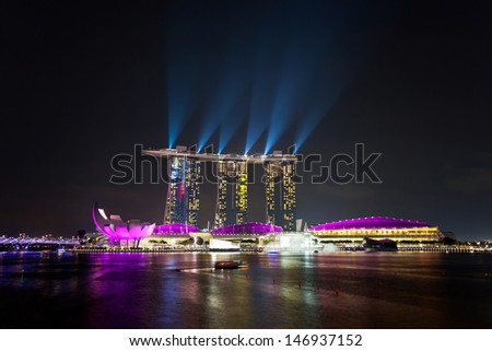 SINGAPORE - APRIL 15 : Laser show of Singapore Marina Bay Sand on April 15, 2013, Singapore. Marina Bay Sands is billed as the world\'s most expensive standalone casino property at S$8 billion