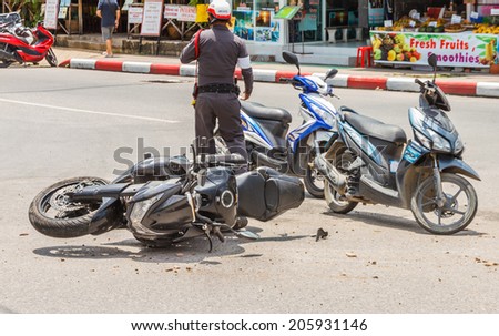 Patong, Phuket, Thailand - July 20 : The motorcycle crash a car at Rauthit Songroipi Road. on July 20, 2014 in Patong, Phuket, Thailand.