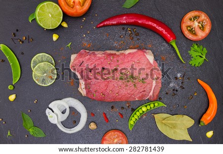 The meat and spices on stone black color for design or decorate project.