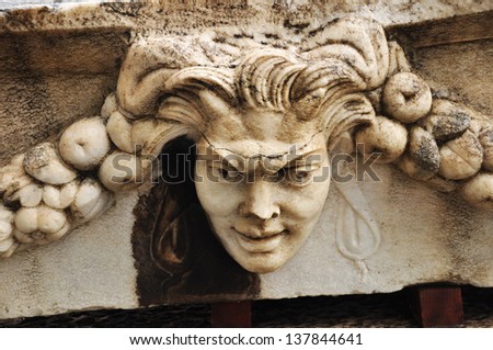 A Closeup of a stone relief. Beautiful relief work in stone and marble are seen on panels designed for burial caskets. Aphrodisias clearly loved sculpture and statues this is evident at the site.