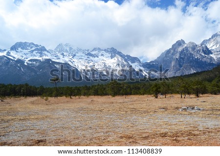 snow mountain with forest background - Jade Dragon Snow Mountain or Mount Yulong in Lijiang country, Yunnan province