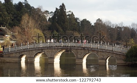 Black Dragon Pool : chinese style bridge on the lake in the park in lijiang old town, the world heritage site of UNESCO