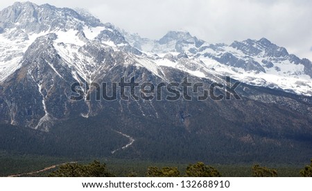 snow mountain with the forest Mount Yulong or Jade Dragon Snow mountains in Lijiang country, Yunnan Province