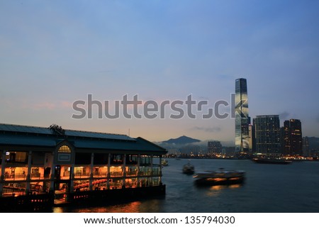 HONG KONG - MARCH 28: The ferry go to the International Commerce Centre in the evening, view from Hong Kong island in Kowloon on March 28 2013. ICC Tower is the tallest building in Hong Kong.
