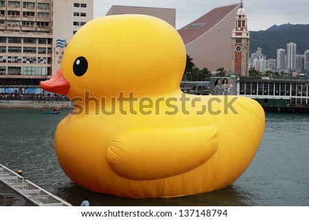 HONG KONG - MARCH 2:the rubber duck swim in Victoria Harbour on March 2 2013. Giant \'Rubber Duck\' Sculpture By Artist Florentijn Hofman, visit Hong Kong today which draw the attention of local
