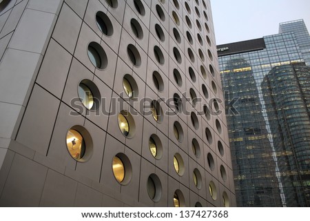 HONG KONG - MARCH 7: round windows of Jardine House in Central on March 7 2013. It is the Hong Kong\'s first modern skyscraper. the round windows is one of the characteristic