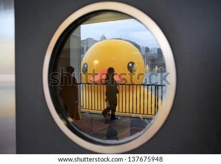 HONG KONG - MAY 2: the duck reflect on the round window in Hong Kong on May 2 2013.Giant \'Rubber Duck\' Sculpture By Florentijn Hofman, come to hong kong and draw the attention of hong kong people