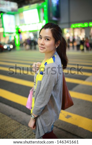 fashion woman love shopping in the downtown city of hong kong mongkok at night