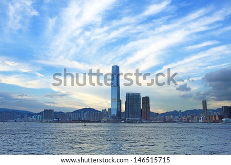 wonderful city landscape of victoria harbour in hong kong with glows , international commerce centre