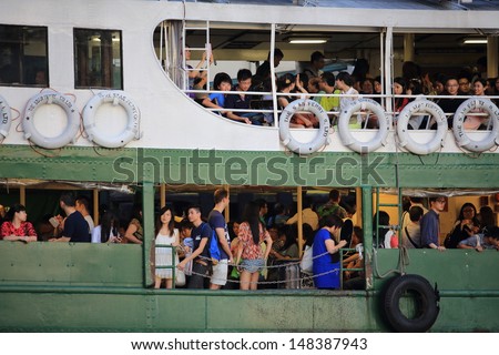 HONG KONG -JULY 20: passengers waiting on the ferry on July 14, 2013 in Hong kong. Its principal routes carry passengers across Victoria Harbor, one of the tourist attraction in Hong Kong