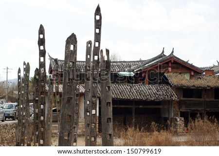 LIJIANG, CHINA -FEB 18: old buildings remain in Lijiang old town on Feb 18 2012.Under china economic growth, rural area and old town develop the tourism industry but culture invasion also occupied