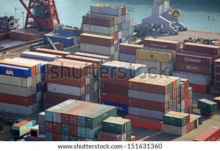 HONG KONG -MAY 5: the cargo boxes at harbor in HongKong on May 5, 2013. Hong Kong features a free trade economy with low taxation in global import and export